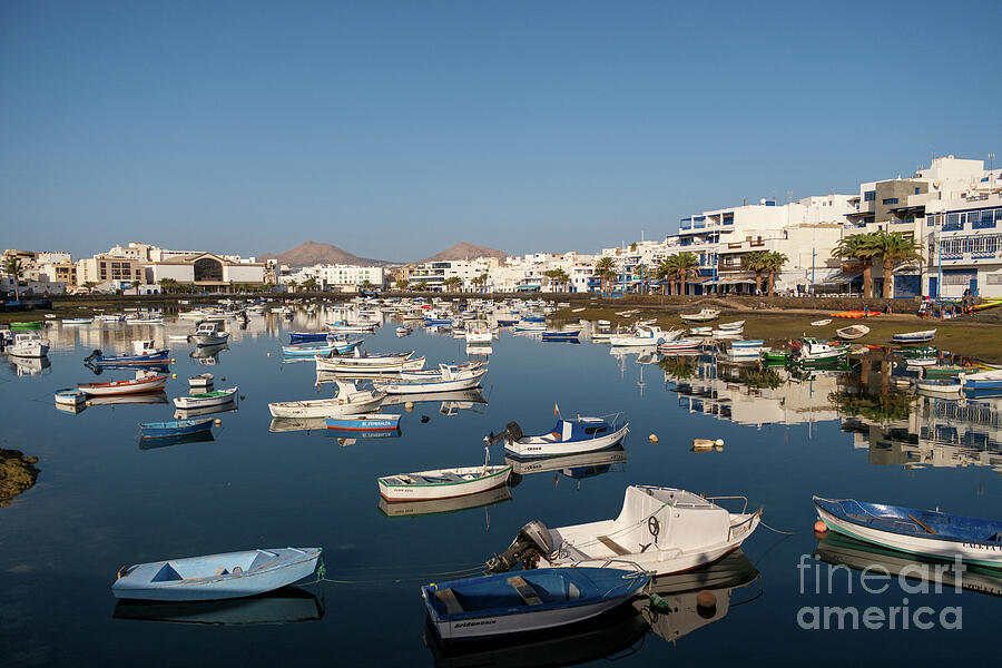 Laguna with boats at Arrecife, Lanzarote. Charco de San Gines, the laguna at the city of Arrecife, c Photograph by Stuart Chard Laguna with boats at Arrecife, Lanzarote. Charco de San Gines, the laguna at the city of Arrecife, c Photograph by Stuart Chard