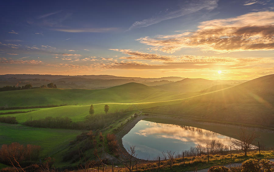Lake and rolling hills in Tuscany Photograph by Stefano Orazzini
