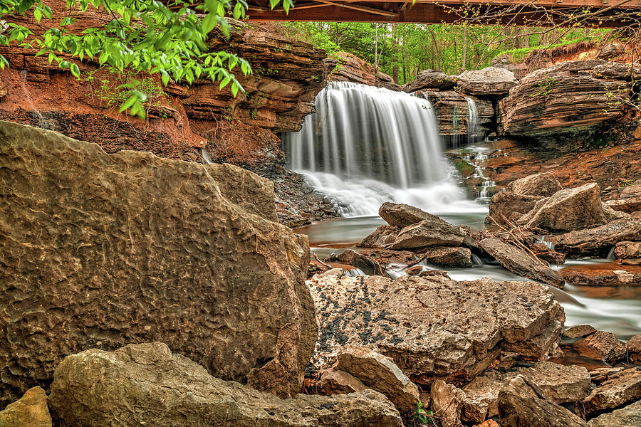 Lake Ann Spillway Waterfall Through The Rocky River Shoreline