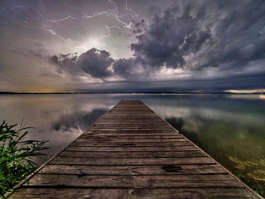 Lake Kegonsa Light Show  - Spring thunderstorm and lightning display with dock at Lake Kegonsa Photograph by Peter Herman