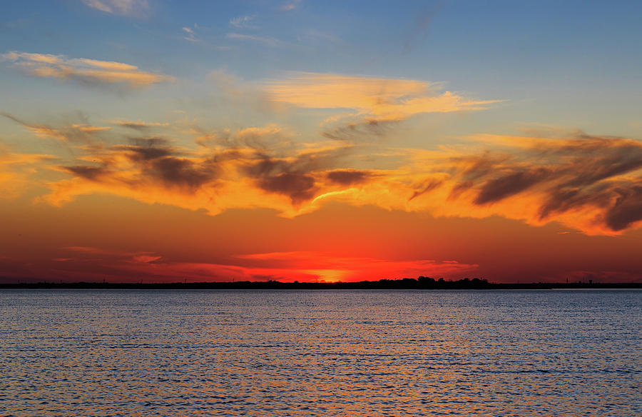 lake-sunset-in-dallas-tx-as-the-sun-set-below-the-horizon-photograph