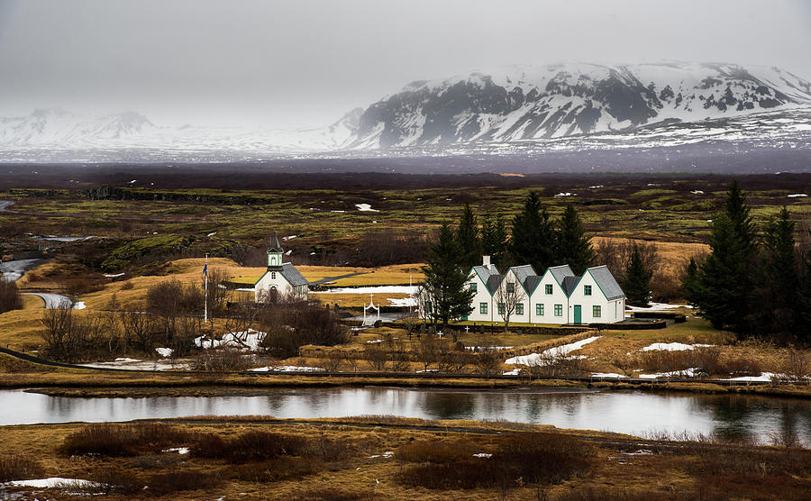 Lakes and houses at Thingvellir national park, golden circle trip in Iceland Photograph by Michalakis Ppalis