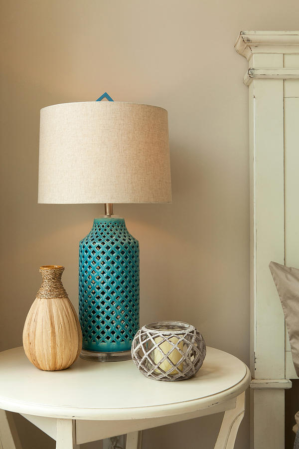 Lamp on table in bedroom Photograph by Andrew Sherman