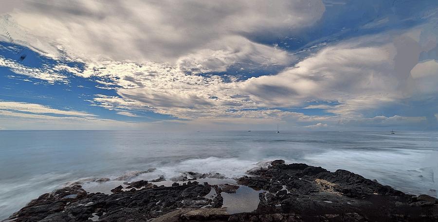 Land meets sea meets cloudy skies Photograph by Lori Seaman