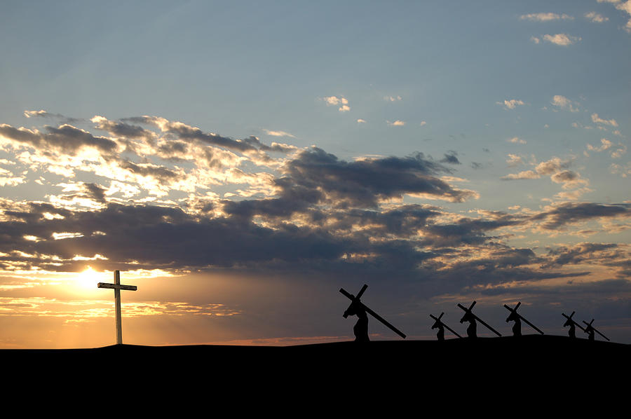 Landscape view of the sun and crosses being carried Photograph by Wwing