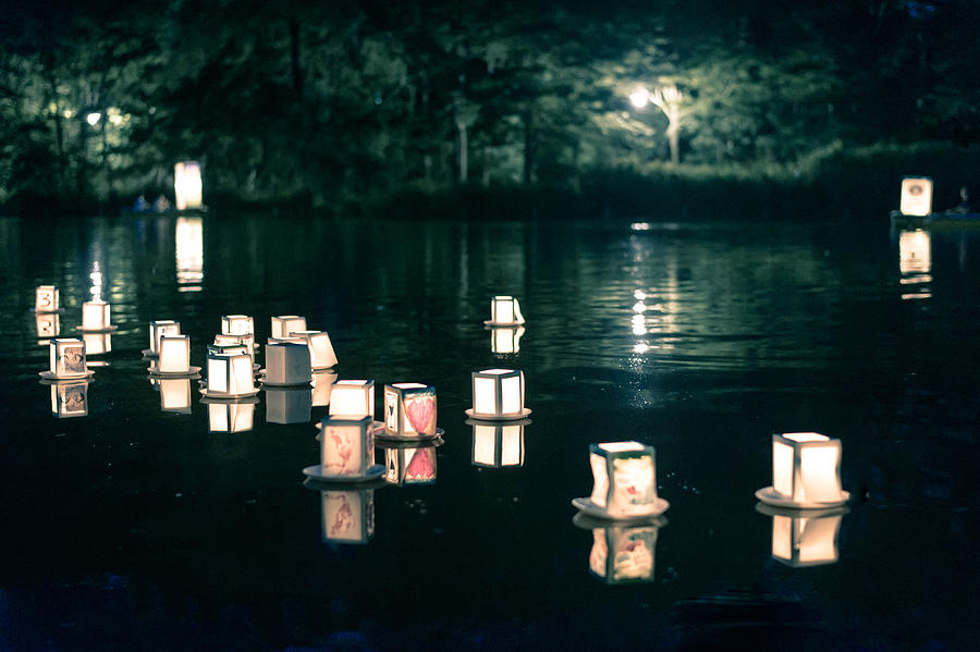 Lantern floating on the night lake Photograph by Hazelog