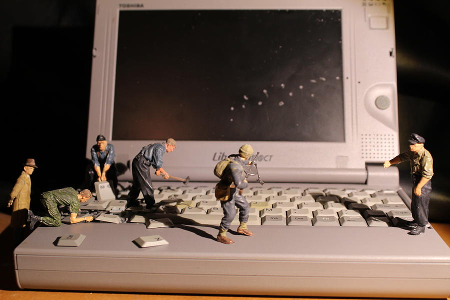 Key Photograph - Laptop by Army Men Around the House