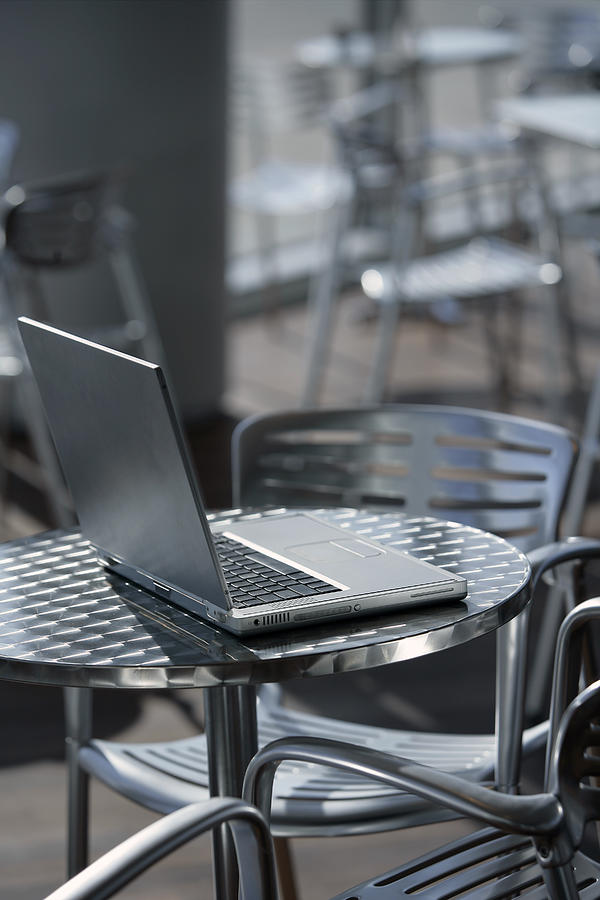 Laptop at a cafe Photograph by Comstock Images