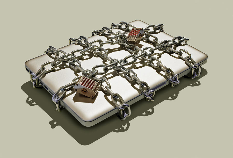 Laptop with chains and padlocks. Photograph by Tim Robberts