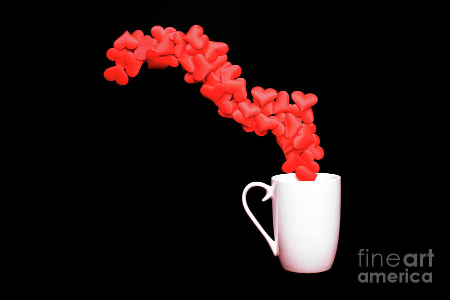 Large empty white coffee cup, with red love hearts gushing out o Photograph by Joaquin Corbalan