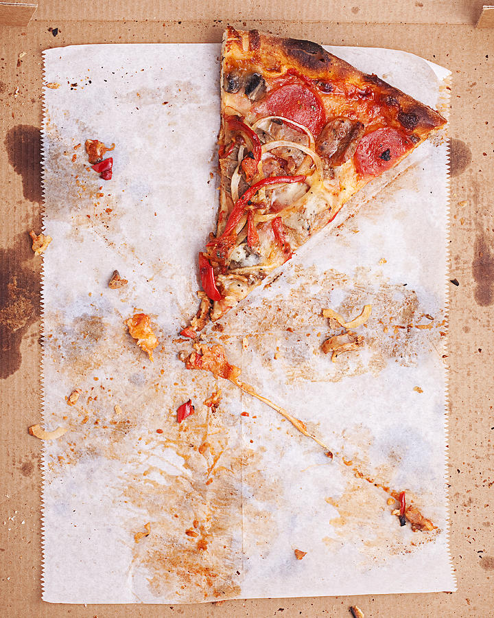 Last slice of pizza Photograph by John Kuczala