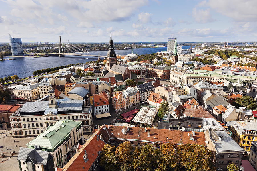 Latvia, Riga, Cityscape of old town and river in distance Photograph by Henryk Sadura