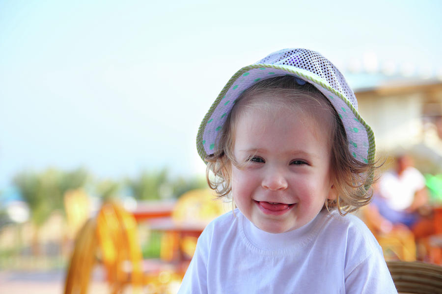 Laughing Little Girl In Hat Photograph by Mikhail Kokhanchikov