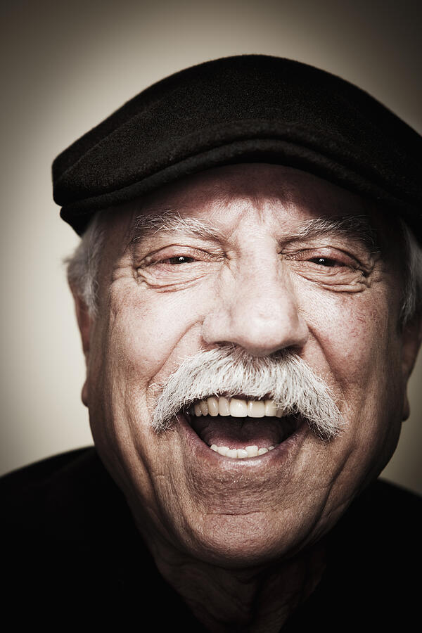Laughing senior man wearing cap Photograph by Steve Peixotto Photography