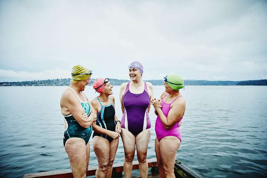 Laughing swimmers preparing for morning swim Photograph by Thomas Barwick