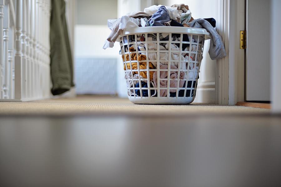 Laundry in laundry basket Photograph by Robert Reader