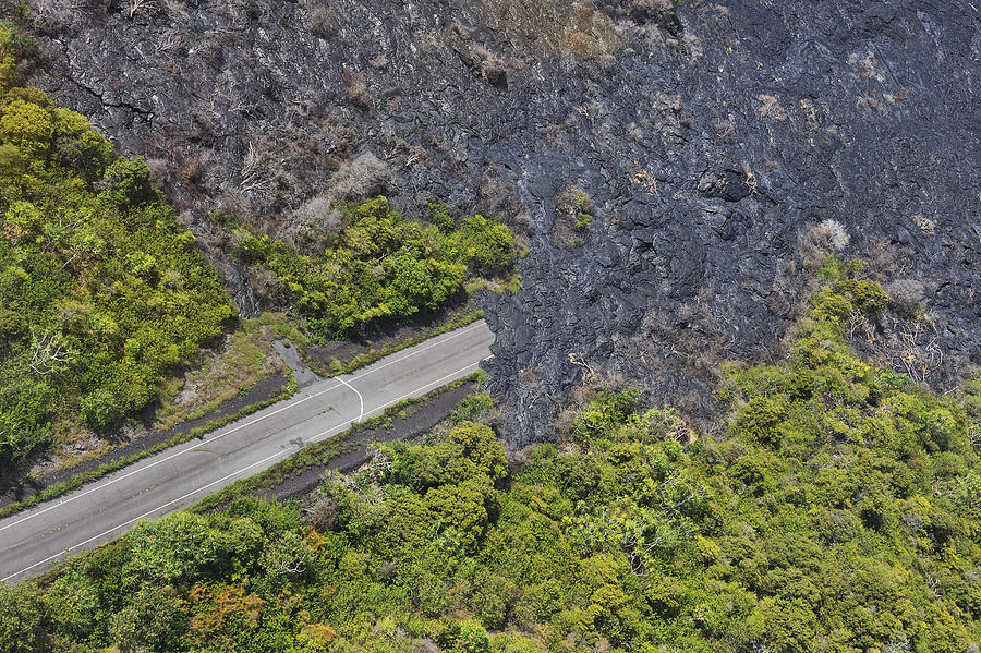 Lava covering a highway, aerial view Photograph by Sami Sarkis