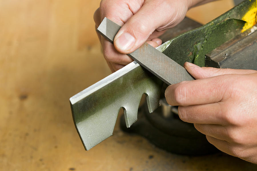 Lawnmower Blade Sharpening with File Photograph by BanksPhotos