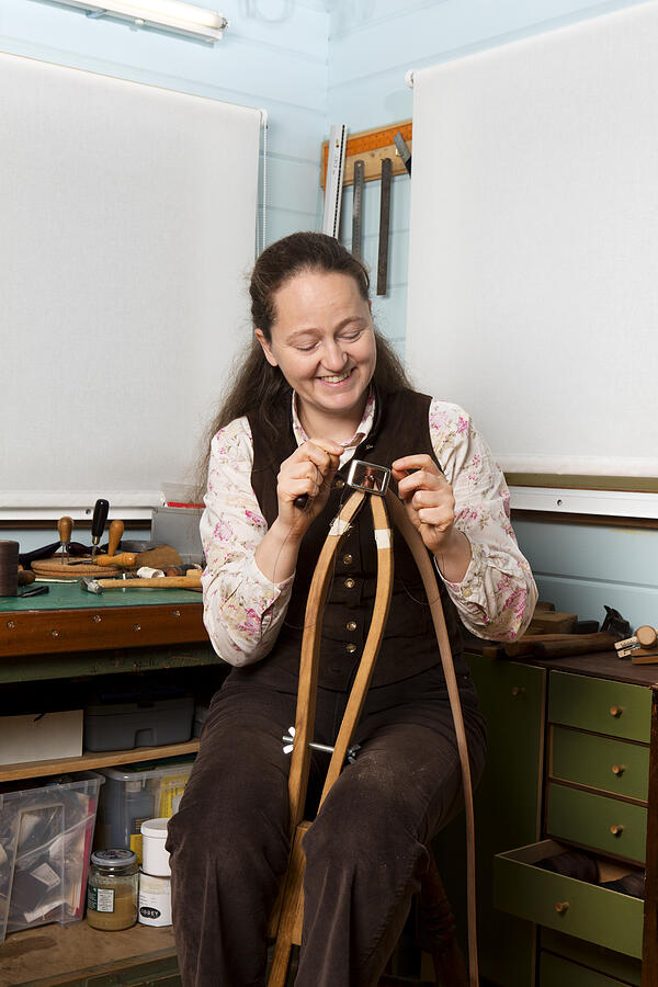 Leather stitcher working on a belt. Photograph by Nicola Tree