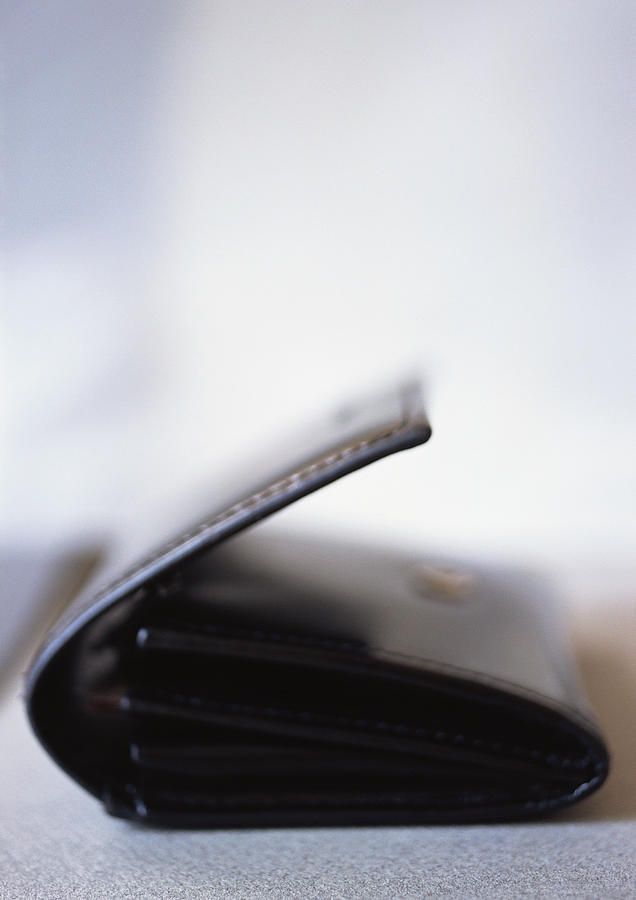Leather wallet, close-up, blurred Photograph by Michele Constantini