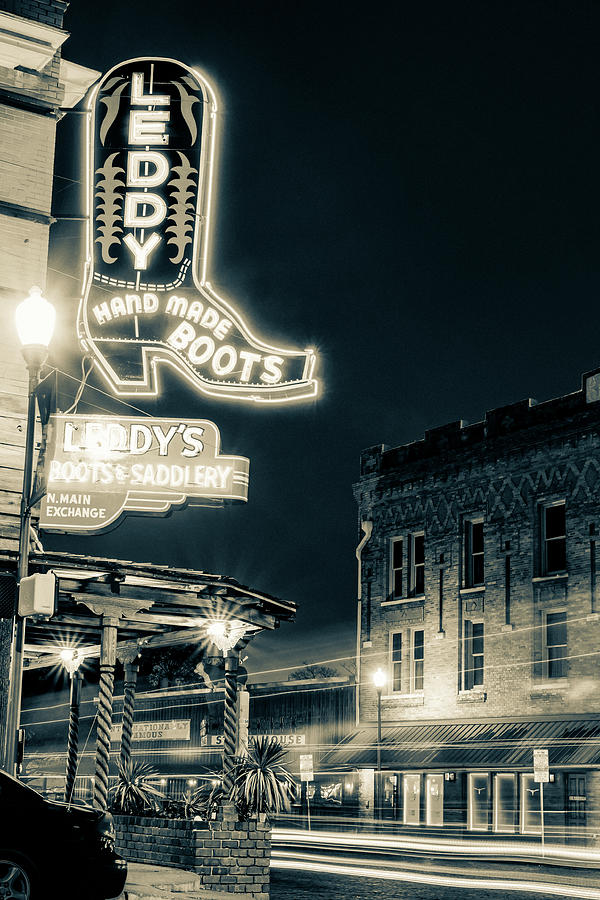 Leddy Boots Lighting Up The Stockyards - A Fort Worth Icon In Sepia Photograph by Gregory Ballos