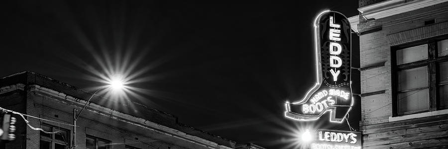 Leddy Cowboy Boot Neon Panorama In Fort Worth Texas - Black And White Photograph by Gregory Ballos