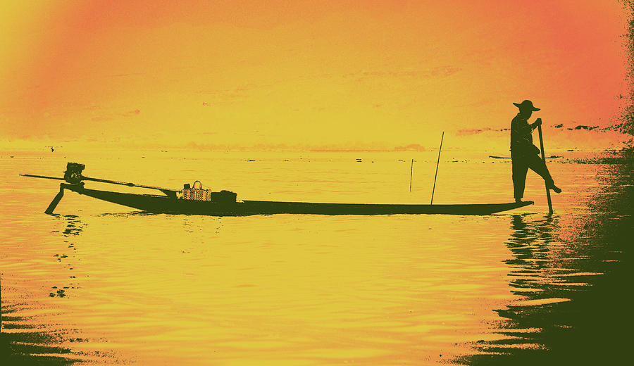 Leg rowing fisherman and his nets  Photograph by Steve Estvanik