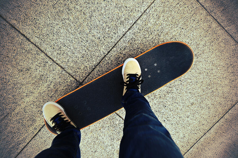 Legs Riding On Skateboard Photograph by Lzf