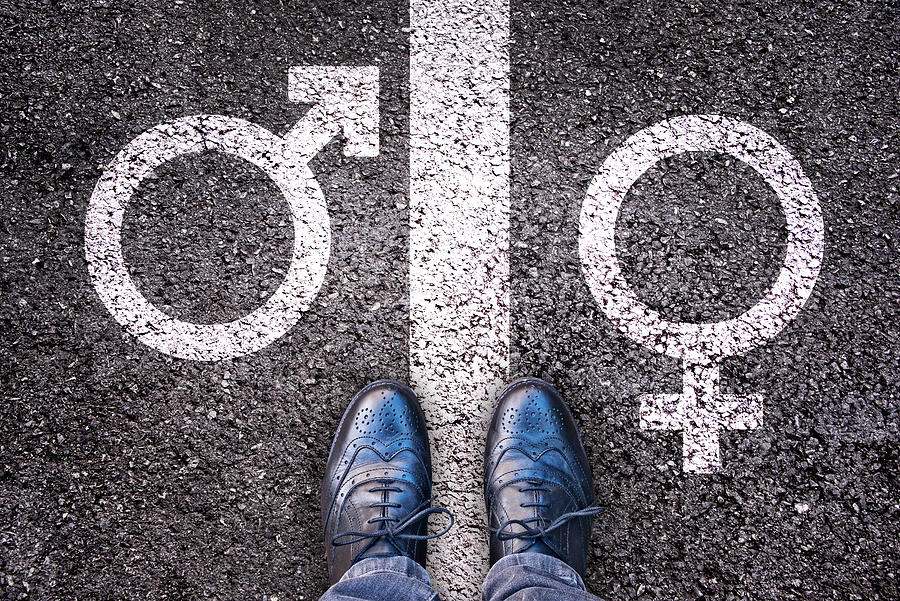 Legs with gender symbol on asphalt, gender concept Photograph by Delpixart