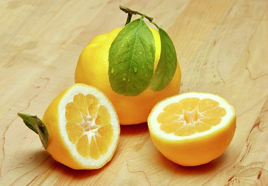 Lemon and Lemon Halves Photograph by Masha Batkova
