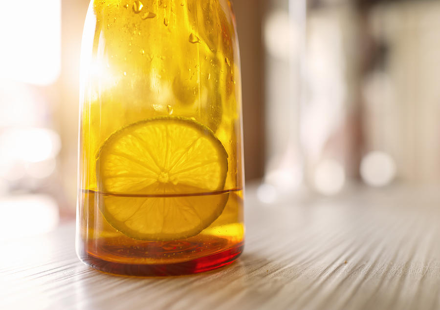 Lemon slice soaking in bottle Photograph by Leren Lu