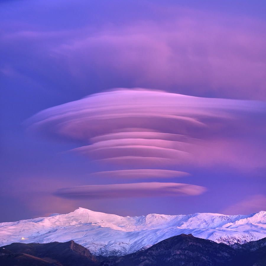 Lenticular clouds at sunset. Sierra Nevada National park. Granada. Spain  Photograph by Guido Montanes Castillo