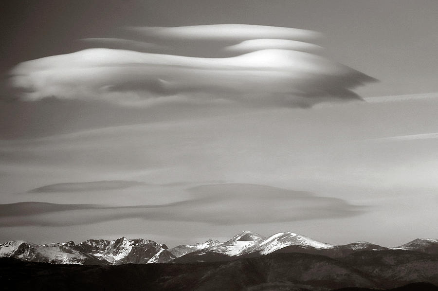 Lenticular clouds over mountains Photograph by Marilyn Hunt