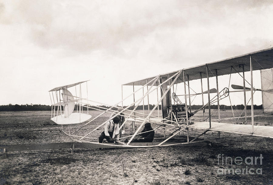 Leon Bollee working on the Wright brothers plane, circa 1909  Photograph by Leon Bollee