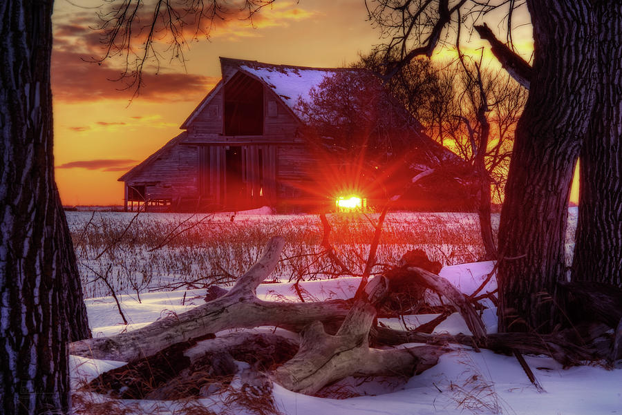 Let His Light Shine Through - sunset through abandoned barn in ND winter scene Photograph by Peter Herman