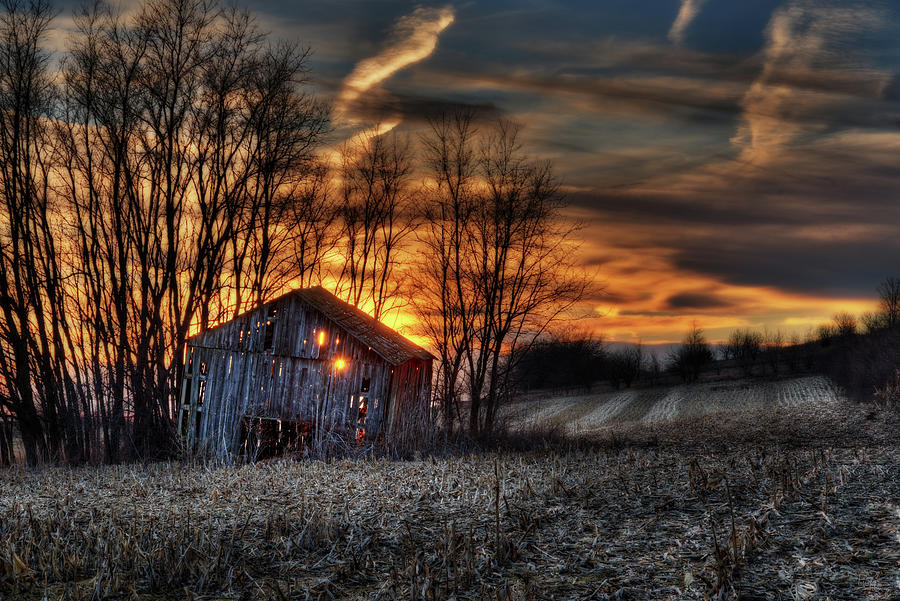 Let the Light Shine Through - sunset through collapsing Wisconsin barn Photograph by Peter Herman