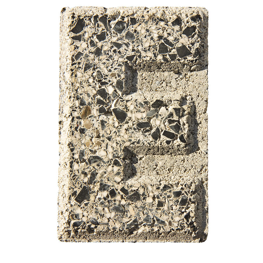 Letter E carved in a concrete block Photograph by France68