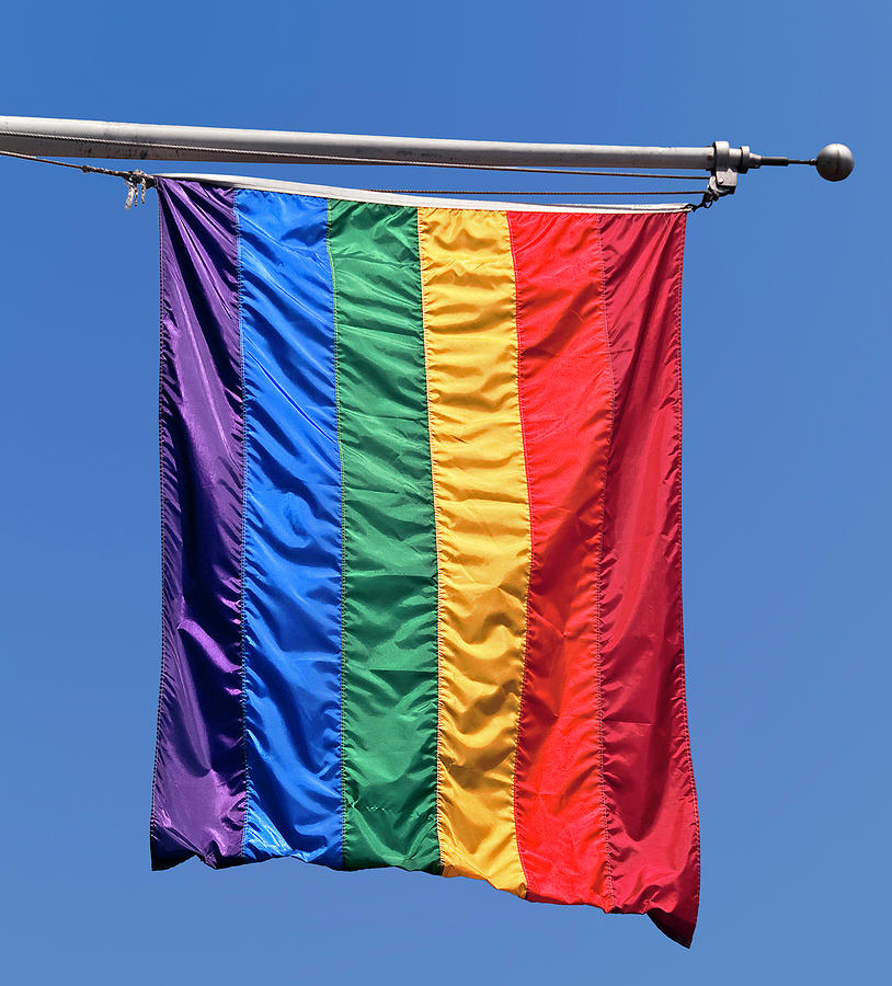 LGBTQ Flag on Flagpole Photograph by Phil Cardamone