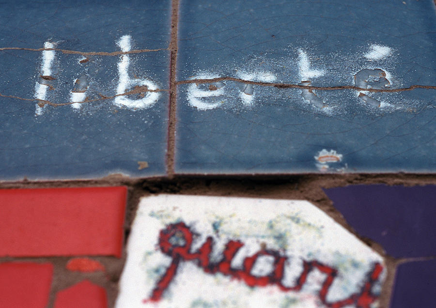 Liberte, French word meaning freedom, written on tiles, close-up Photograph by Isabelle Rozenbaum