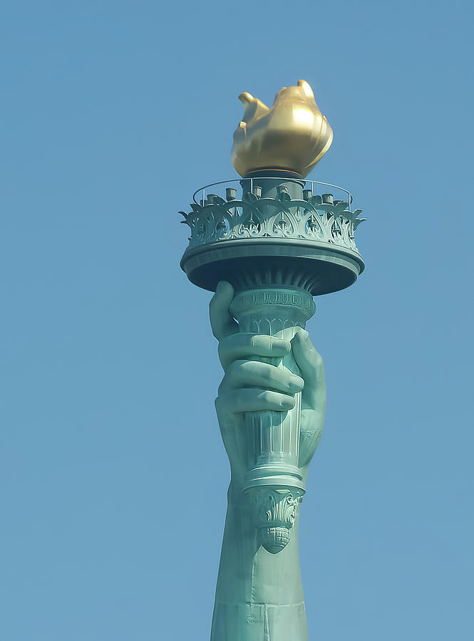 Liberty flame close-up photo with a pure blue sky in July. Photograph by Jean-Luc Farges