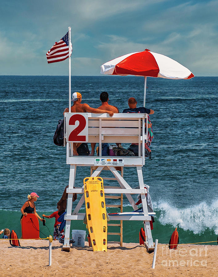 Life Guards on the beach Photograph by Nick Zelinsky Jr