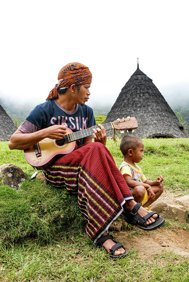 Musician Photograph - Lullaby - Wae Rebo Village. Flores, Indonesia by Earth And Spirit
