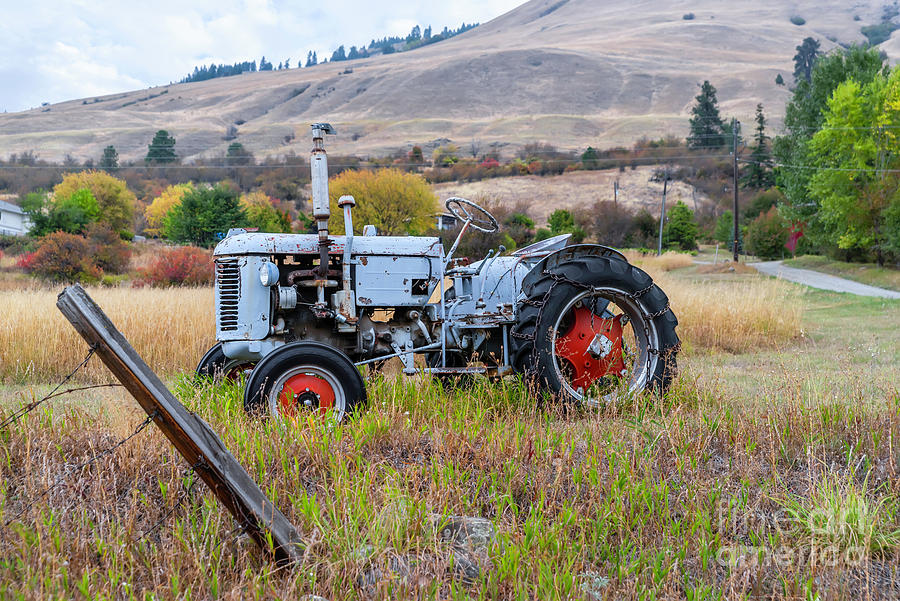 Life Of An Old Tractor On A Farm. Photograph