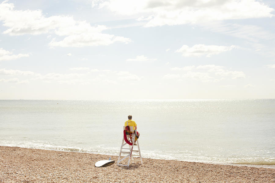 Lifeguard looking out to sea Photograph by Ezra Bailey