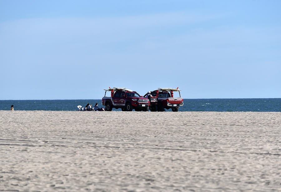 Lifeguard trucks on Huntington Beach Photograph by Mark Stout