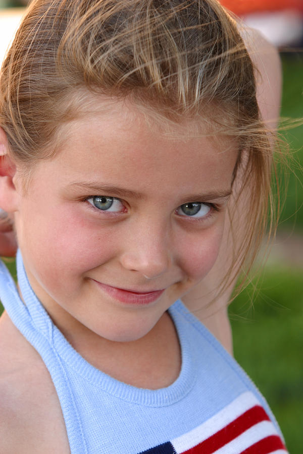 Lifestyle Photo Of A Little Caucasian Girl In A Blue Tank Top As She Smiles Photograph by Photodisc