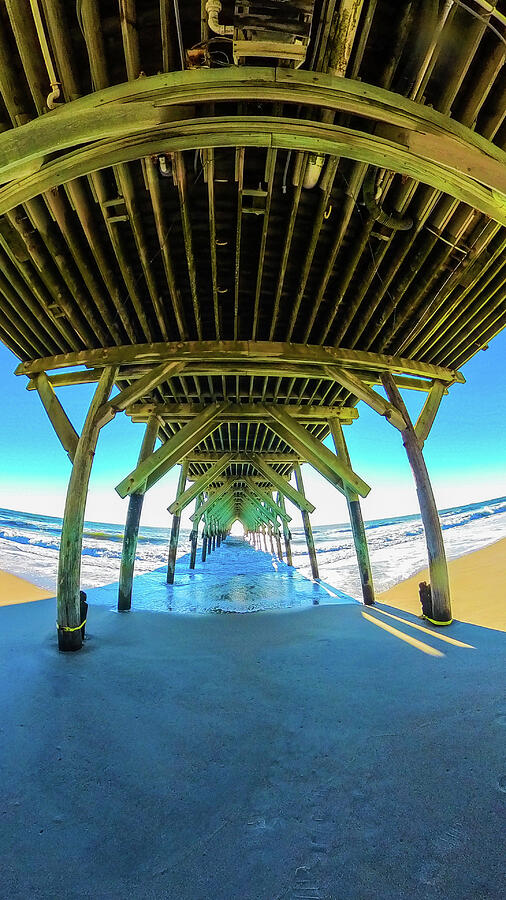 Light at the end of the pier. Photograph by Oceanic SkyView Light at the end of the pier. Photograph by Oceanic SkyView