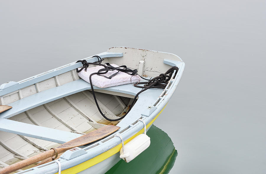 Light Blue Rowboat On Calm Waters Photograph