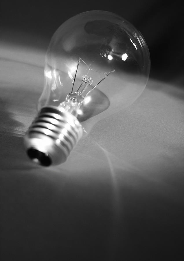 Light bulb, b&w. Photograph by Laurent Hamels