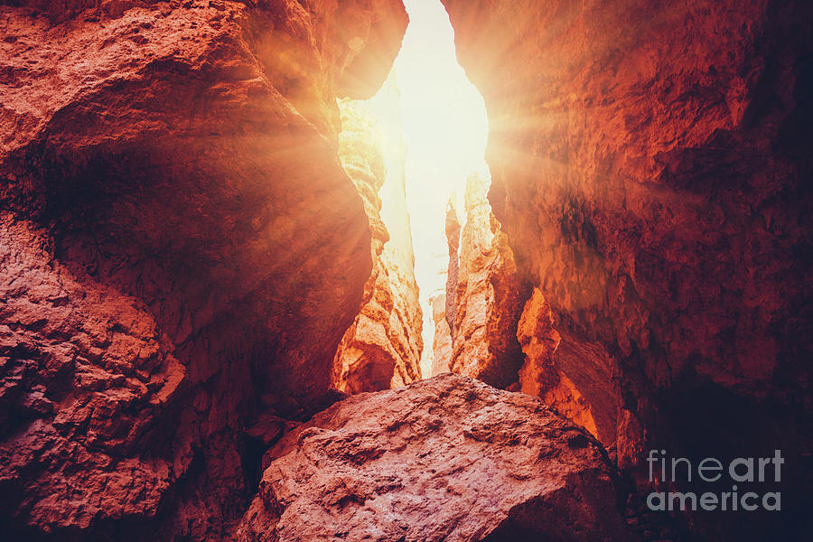 Light shining through rocks in Bryce Canyon, Utah, USA. Photograph by Michal Bednarek